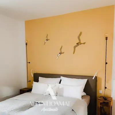 Ein Bett oder Betten in einem Zimmer der Unterkunft Alpenhoamat Apartments
