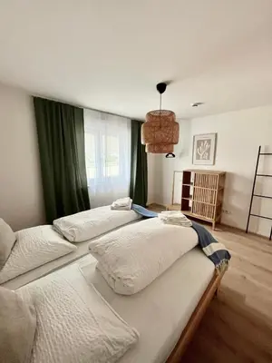 Ein Bett oder Betten in einem Zimmer der Unterkunft Ferienwohnung Am bayrischen Meer