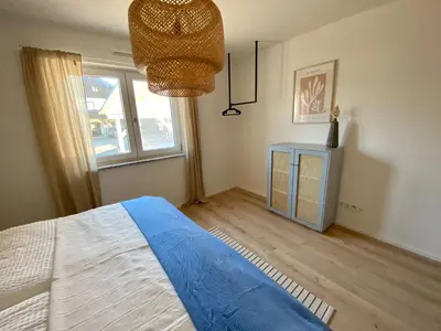 Ein Bett oder Betten in einem Zimmer der Unterkunft Ferienwohnung Am bayrischen Meer