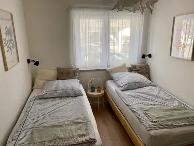 Ein Bett oder Betten in einem Zimmer der Unterkunft Ferienwohnung Am bayrischen Meer