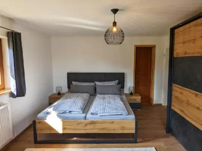 Ein Bett oder Betten in einem Zimmer der Unterkunft Landhaus Glücksmoment