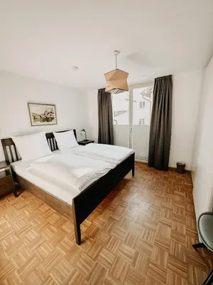 Ein Bett oder Betten in einem Zimmer der Unterkunft Hotel Hofwirt Neubeuern