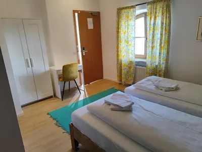 Ein Bett oder Betten in einem Zimmer der Unterkunft Estelada Boarding Houses Zorneding