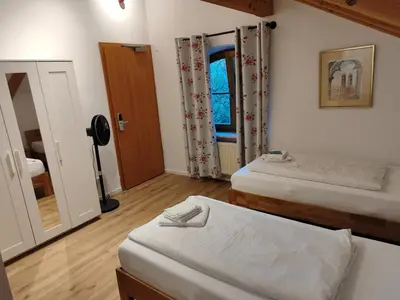 Ein Bett oder Betten in einem Zimmer der Unterkunft Estelada Boarding Houses Zorneding