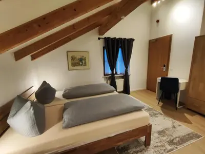 Ein Bett oder Betten in einem Zimmer der Unterkunft Estelada Boarding Houses Zorneding