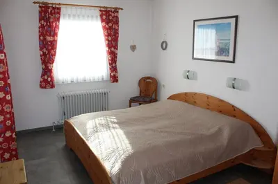 Ein Bett oder Betten in einem Zimmer der Unterkunft Ferienhaus Nr 124, Typ A, Feriendorf Hochbergle, Allgäu