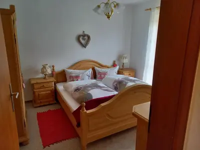 Ein Bett oder Betten in einem Zimmer der Unterkunft Ferienwohnung Bayrischzell