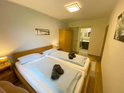 Ein Bett oder Betten in einem Zimmer der Unterkunft Ferienwohnung 5 Bergschlössl Oberaudorf