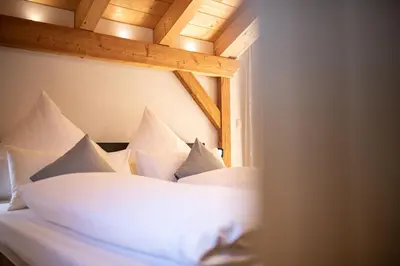 Ein Bett oder Betten in einem Zimmer der Unterkunft am Josefibrunnen