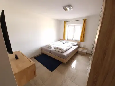 Ein Bett oder Betten in einem Zimmer der Unterkunft Ferienwohnung Jehl