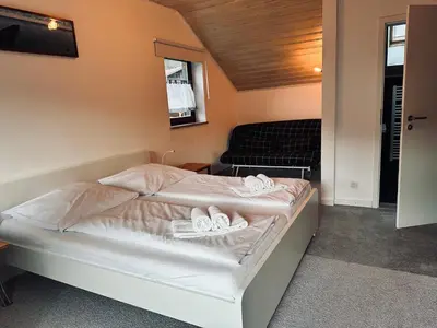 Ein Bett oder Betten in einem Zimmer der Unterkunft Apartment BERGfamilie - gemütlich ausgestattet, ruhig und familienfreundlich