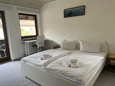 Ein Bett oder Betten in einem Zimmer der Unterkunft Apartment BERGfamilie - gemütlich ausgestattet, ruhig und familienfreundlich