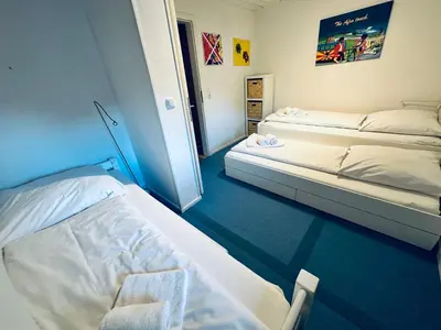 Ein Bett oder Betten in einem Zimmer der Unterkunft Apartment BERGfamilie - gemütlich ausgestattet, ruhig und familienfreundlich