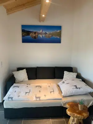 Ein Bett oder Betten in einem Zimmer der Unterkunft Allgäu-Chalet Kaufbeuren