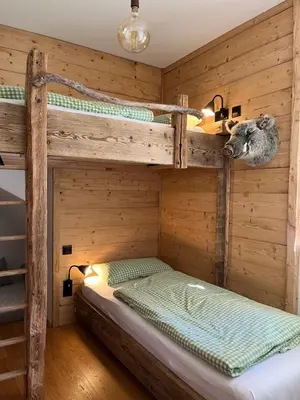 Ein Bett oder Betten in einem Zimmer der Unterkunft Ferienwohnung Sunnseitn