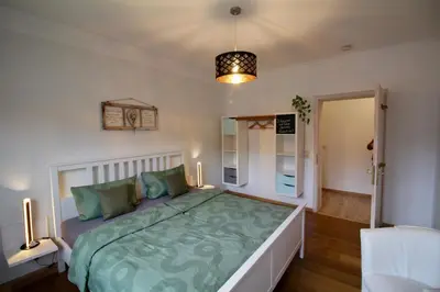 Ein Bett oder Betten in einem Zimmer der Unterkunft Ferienwohnung Landhaus zum Sonnenschein
