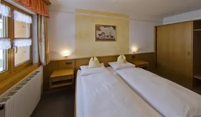 Ein Bett oder Betten in einem Zimmer der Unterkunft Gasthof und Pension Neuwirt