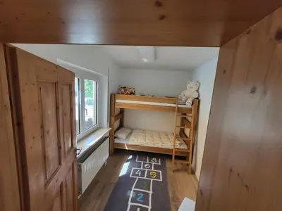 Ein Bett oder Betten in einem Zimmer der Unterkunft Family's Nest Chiemsee