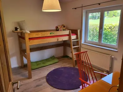Ein Bett oder Betten in einem Zimmer der Unterkunft Family's Nest Chiemsee