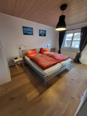 Ein Bett oder Betten in einem Zimmer der Unterkunft Family's Nest Chiemsee