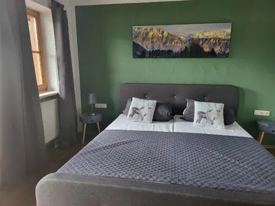 Ein Bett oder Betten in einem Zimmer der Unterkunft Ferienwohnungen beim Silbergersee