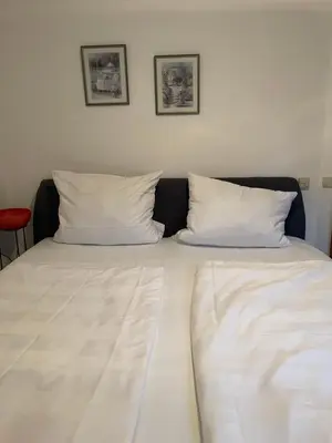 Ein Bett oder Betten in einem Zimmer der Unterkunft Ferienwohnung Hochfelln