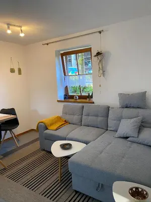 Ein Sitzbereich in der Unterkunft Ferienwohnung Hochfelln