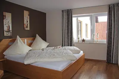 Ein Bett oder Betten in einem Zimmer der Unterkunft Hotel - Restaurant Eberlwirt