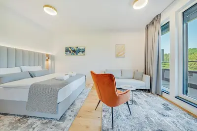 Ein Bett oder Betten in einem Zimmer der Unterkunft BRIGHT: Rosenheim Aicherpark