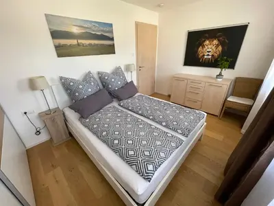 Ein Bett oder Betten in einem Zimmer der Unterkunft Ferienwohnung Hochriesblick