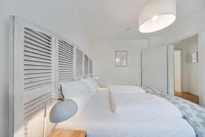 Ein Bett oder Betten in einem Zimmer der Unterkunft Ferienwohnung mit Garten am Chiemsee