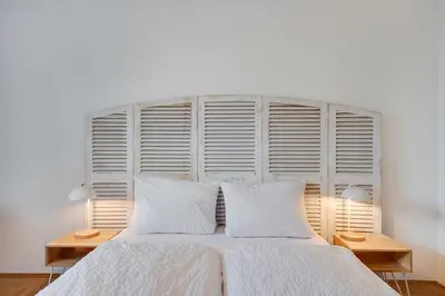 Ein Bett oder Betten in einem Zimmer der Unterkunft Ferienwohnung mit Garten am Chiemsee