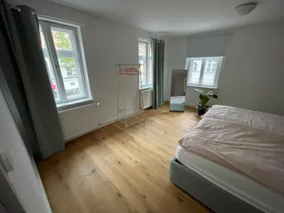 Ein Bett oder Betten in einem Zimmer der Unterkunft Dachau Altstadt Apartment mit Küche für bis zu 6 Gäste nahe Schloss und ÖPNV