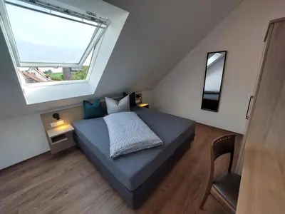 Ein Bett oder Betten in einem Zimmer der Unterkunft Lohauserhof - Biohof und Hotel
