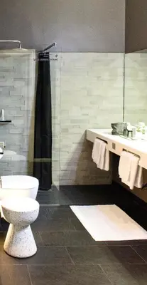 Ein Badezimmer in der Unterkunft Puro-Design-Apartment Deluxe - very central
