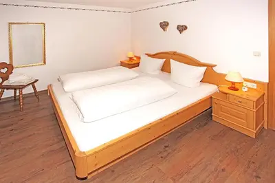 Ein Bett oder Betten in einem Zimmer der Unterkunft Gästehaus Dreitorspitz