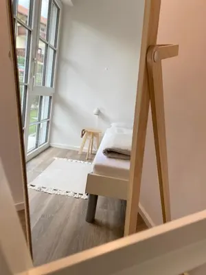 Ein Bett oder Betten in einem Zimmer der Unterkunft Das Bad Wiessee 22