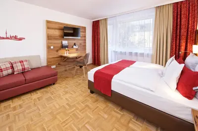 Ein Bett oder Betten in einem Zimmer der Unterkunft Park Hotel Laim Serviced Apartments