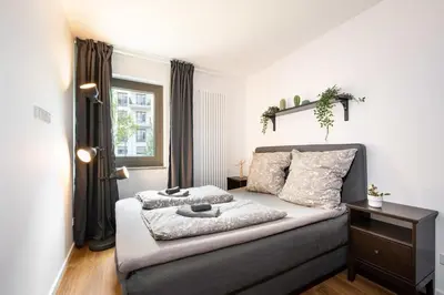Ein Bett oder Betten in einem Zimmer der Unterkunft Urban Apartment with 2 Bedrooms