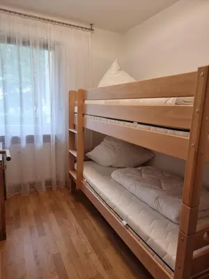 Ein Bett oder Betten in einem Zimmer der Unterkunft Ferienwohnung Kuhsee