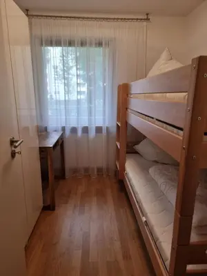 Ein Bett oder Betten in einem Zimmer der Unterkunft Ferienwohnung Kuhsee