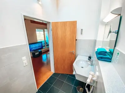 Ein Badezimmer in der Unterkunft Hotel Schwertfirm