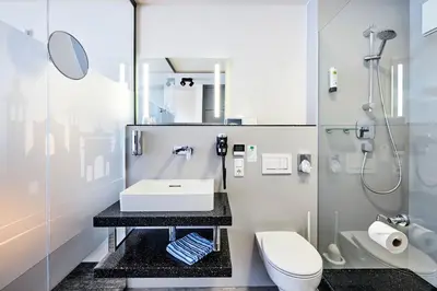Ein Badezimmer in der Unterkunft Hotel Schwertfirm