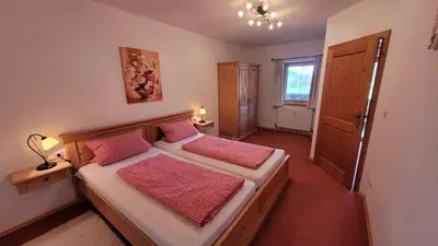 Ein Bett oder Betten in einem Zimmer der Unterkunft Georgihof Ferienwohnungen