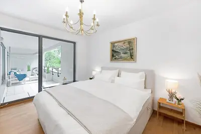 Ein Bett oder Betten in einem Zimmer der Unterkunft Zwei Zimmer Wohnung im Stadtzentrum mit Tiefgaragenplatz