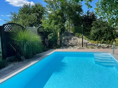 Der Swimmingpool an oder in der Nähe von Schöne Wohnung mit Pool und Sauna zum Wohlfühlen
