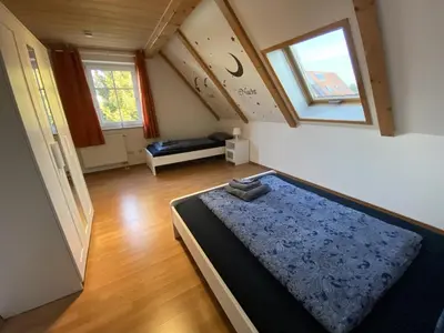 Ein Bett oder Betten in einem Zimmer der Unterkunft Ferienhaus Kutzenhausen