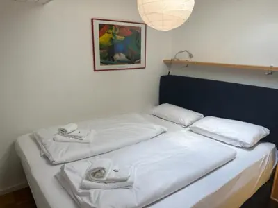 Ein Bett oder Betten in einem Zimmer der Unterkunft Apartment Wendelsteinblick - Wohnen auf Zeit - Homeoffice - Balkon mit Bergblick- buchbar ab 28 Nächte