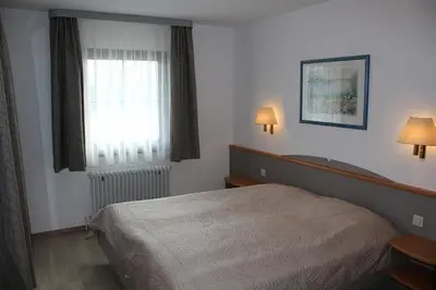 Ein Bett oder Betten in einem Zimmer der Unterkunft Ferienhaus Nr 42, Typ A, Feriendorf Hochbergle, Allgäu