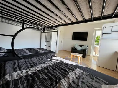 Ein Bett oder Betten in einem Zimmer der Unterkunft Residenz am Roten Tor